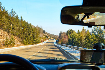 Siberia, Russia - November 28, 2020: View from of car interior from side of driver to the road and...