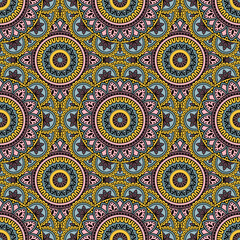 Abstract seamless mandala background. Texture in pink ad yellow colors. Oriental pattern for design, fashion print, scrapbooking