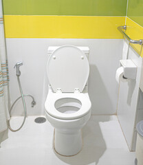 The bathroom is clean inside is a toilet seat.