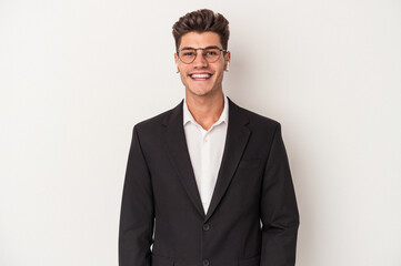 Fototapeta premium Young business caucasian man wearing headphones isolated on white background happy, smiling and cheerful.