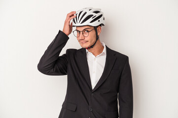 Young business caucasian man holding bike helmet isolated on white background being shocked, she has remembered important meeting.