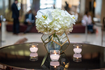 Flower and candle table setting at elegant affair.