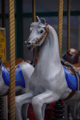 Detail of a horse in a carousell for kids