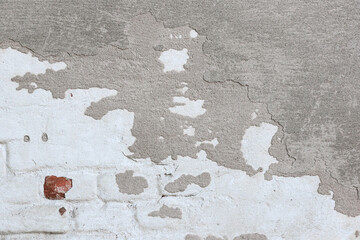 material texture of damaged and cracked plaster wall, surface background