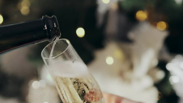 Champagne. One glass of sparkling wine on the New Year table.