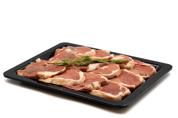 Marinated raw lamb ribeye on a white background. Lamb ribeye marinated in olive oil and various spices