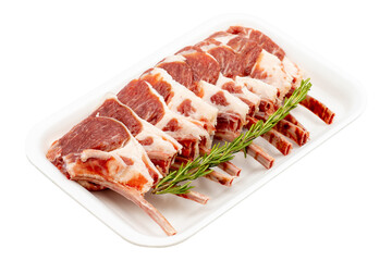 Marinated raw lamb chops on a white background. Lamb chops marinated in olive oil and various spices