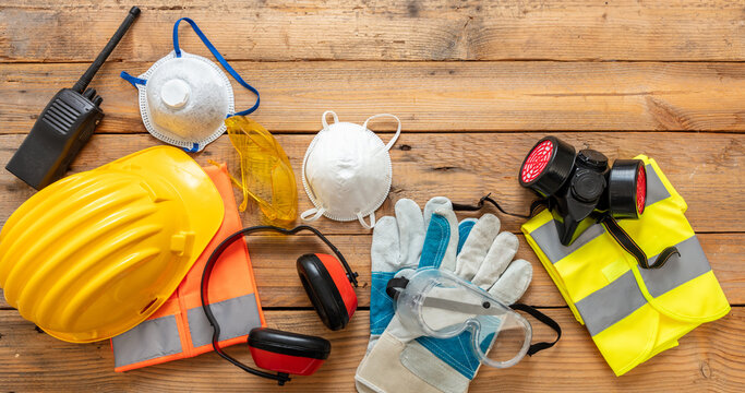 Work health and safety flat lay. Labor personal protective gear for industry and construction site.
