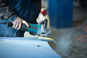 Sanding polishing of the bumper on the car at a hundred close-up