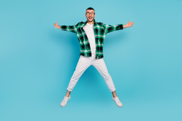 Full body photo of happy cool cheerful man jump star shape fly good mood enjoy isolated on blue color background