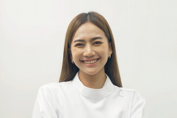 Portrait of happy Asian dentist woman, people smiling to the camera at hospital clinic. Doctor isolated on white. Dentistry. Medical and dental health.