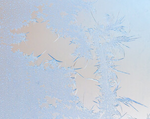 Snowflakes on glass as a background.