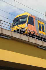 yellow train on the bridge