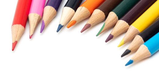 Multi-colored pencils on a white background.