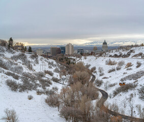Curved road in the middle of snowy hills at Salt Lake City, Utah
