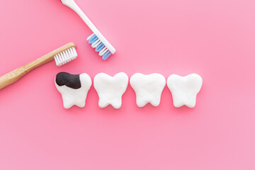 Oral health and care concept - clean teeth models with toothbrush