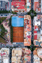 Drone view of city blocks with sports fields