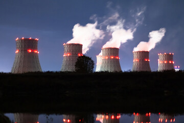 nuclear power plant at night. Air emissions