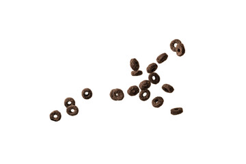 Chocolate rings cereal spill out into a bowl. Breakfast.