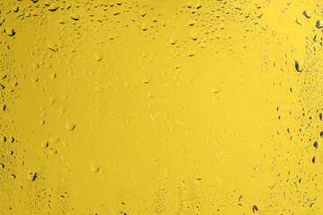 Yellow backgrond with water drops.