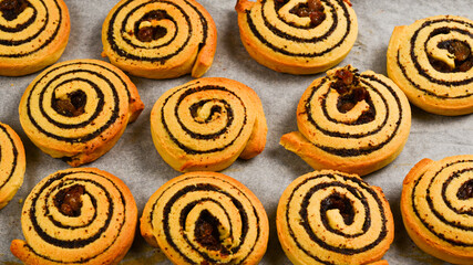 Baked cookies with raisins and poppy seeds on a trail.