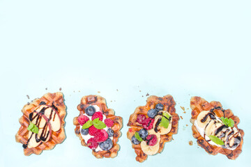 Modern dessert croffle - mixture of croissants and waffles, puff baking waffle iron pan, with berry, fruit cocolate topping