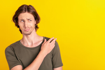 Photo of young arrogant man narcissistic wondered guess look empty space isolated over yellow color...