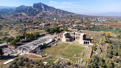 Aerial view with drone; Sardes (Sardis) Ancient City which has gymnasium and synagogue ruins and columns in Manisa, Turkey.
