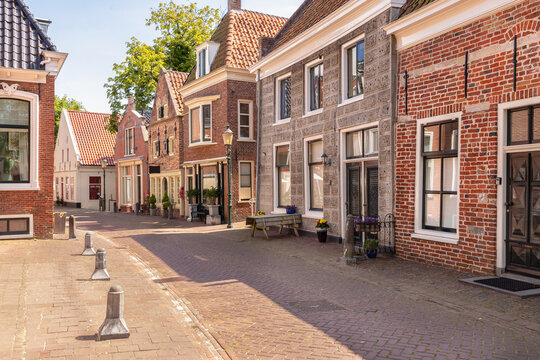Narrow street with old houses in the picturesque town of Appingedam in the province of Groningen; Netherlands.