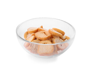 Delicious crispy rusks in glass bowl on white background