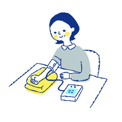 
血圧を測る女性