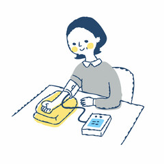
血圧を測る女性