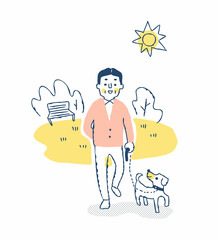 公園を犬と散歩する男性