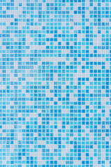 Vertical photo of blue mosaic. Texture, background of white and blue ceramic mosaic.