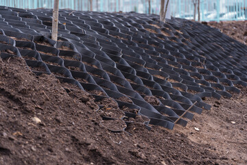 Black polymer wire mesh for strengthening the earthen slopes