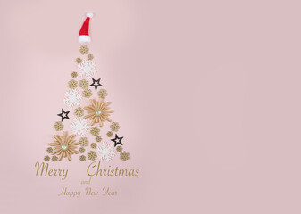 Fototapeta na wymiar Christmas tree made from golden, white and black snowflakes and stars on pink background. New year and Christmas greeting card decoration. Composition for Happy New Year background.
