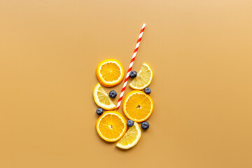 Cocktail concept. Glass of juice made of citrus with cocktail tube