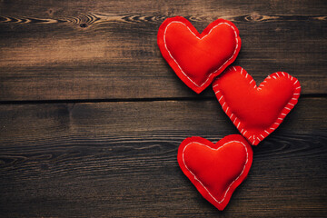 Naklejka na ściany i meble Valentine's day hearts on wooden background decoration object