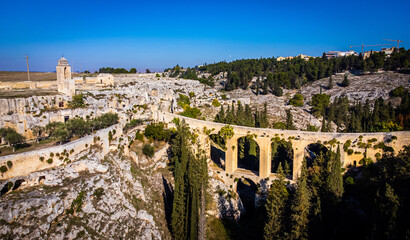 Fototapeta na wymiar Gravina in Puglia with its famous aqueduct in Italy - aerial view - travel photography