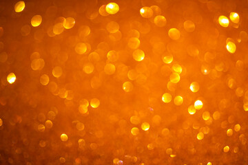 Orange bokeh background. Vintage glitter lights, glowing christmas effects backdrop photo