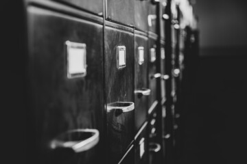 a row of old black filing cabinets 