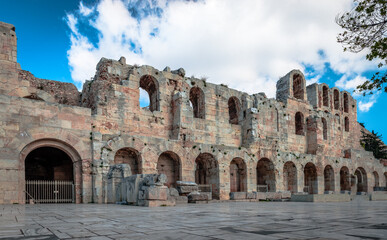 Obraz premium The facade of the Odeon of Herodes Atticus, in Athens, Greece. It is an ancient stone theatre, built in 161 AD, located on the southwest slope of the Acropolis of Athens.