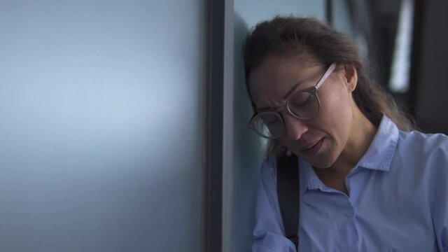 Upset depressed woman crying leaving doctors office, bad diagnosis, miscarriage