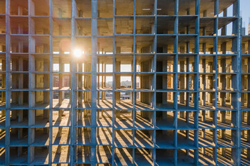 Sun shining through the concrete cells on the construction site