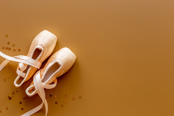 Used ballet pointe shoes or slippers with ribbon, top view