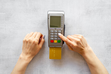 Hand paying by card with pos payment terminal. Payment transactions concept