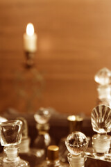 Perfumes and candle out of focus