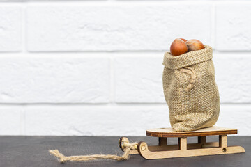 Obraz na płótnie Canvas Grocery basket with hazelnuts on a gray background