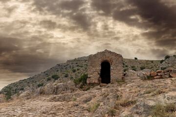 medieval guardhouse on the way to the castle of torroella de montgri at sunset