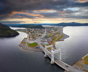 Dramatic skies over a town with a lift bridge